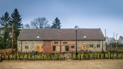 The exterior of 1 Morville Barn on the left, attached to 2 Morville Barn on the right, Shropshire